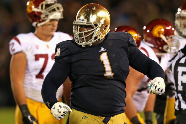 SOUTH BEND, IN - OCTOBER 19: Louis Nix III #1 of the Notre Dame Fighting Irish celebrates near the end of the game against the University of Southern California Trojans at Notre Dame Stadium on October 19, 2013 in South Bend, Indiana. Notre Dame defeated 
