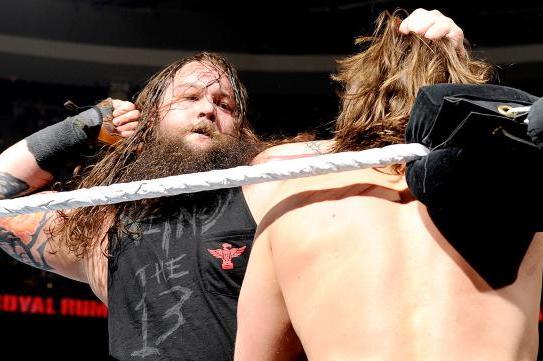 Bray Wyatt readies a punch for Daniel Bryan.