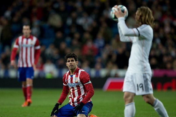 MADRID, SPAIN - FEBRUARY 05: Diego Costa of Atletico de Madrid lies on the ground during the Copa del Rey semifinal first leg match between Real Madrid CF and Club Atletico Madrid at Estadio Santiago Bernabeu on February 5, 2014 in Madrid, Spain.  (Photo 