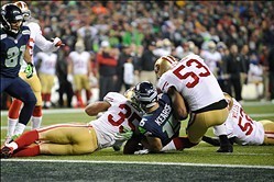 Jan 19, 2014; Seattle, WA, USA; San Francisco 49ers inside linebacker NaVorro Bowman (53) injures his knee against Seattle Seahawks wide receiver Jermaine Kearse (15) during the 2013 NFC Championship football game at CenturyLink Field. Seattle defeated Sa