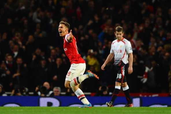 LONDON, ENGLAND - NOVEMBER 02: Aaron Ramsey of Arsenal celebrates scoring their second goal during the Barclays Premier League match between Arsenal and Liverpool at Emirates Stadium on November 2, 2013 in London, England.  (Photo by Laurence Griffiths/Ge