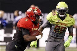 Jan 2, 2014; St. Petersburg, FL, USA; Team Highlight running back Leonard Fournette (5) runs with the ball during the first half as Team Nitro defensve end Chad Thomas (99) defends in the Under Armour All America football game at Tropicana Field. Mandator
