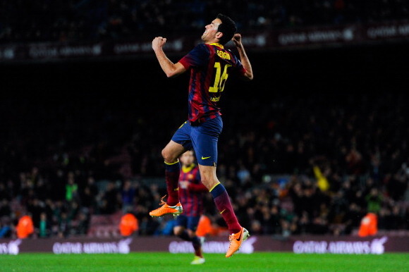 BARCELONA, SPAIN - FEBRUARY 05:  Sergio Busquets of FC Barcelona celebrates after scoring the opening goal during the Copa del Rey Semi-Final first leg match between Barcelona and Real Sociedad at Camp Nou on February 5, 2014 in Barcelona, Spain.  (Photo 