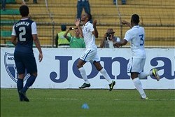 Feb 6, 2013; San Pedro Sula, HONDURAS; Honduras forward Jerry Bengston (11) celebrates with defender Maynor Figueroa (3) after scoring the decisive goal as USA defender Timmy Chandler (2) watches in the second half of a 2014 FIFA World Cup qualifying matc