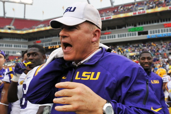 TAMPA, FL -  JANUARY 1:  Head coach Les Miles of the LSU Tigers celebrates after the final play against the Iowa Hawkeyes January 1, 2014  in the Outback Bowl at Raymond James Stadium in Tampa, Florida.  LSU won 21 - 14. (Photo by Al Messerschmidt/Getty I