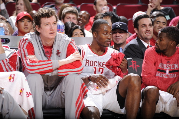 HOUSTON, TX - OCTOBER 5:  Dwight Howard #12 and Omer Asik #3 of the Houston Rockets react to a play against the New Orleans Pelicans during the 2013 NBA pre-season game on October 5, 2013 at the Toyota Center in Houston, Texas. NOTE TO USER: User expressl