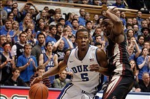 Jan 25, 2014; Durham, NC, USA; Duke Blue Devils forward Rodney Hood (5) drives against Florida State Seminoles guard Ian Miller (30) at Cameron Indoor Stadium. Mandatory Credit: Mark Dolejs-USA TODAY Sports