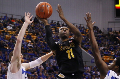 TERRE HAUTE, IN - FEBRUARY 05: Cleanthony Early #11 of the Wichita State Shockers splits the defense of Justin Gant #5 and Demetrius Moore #15 of the Indiana State Sycamores at Hulman Center on February 5, 2014 in Terre Haute, Indiana. Wichita State defea