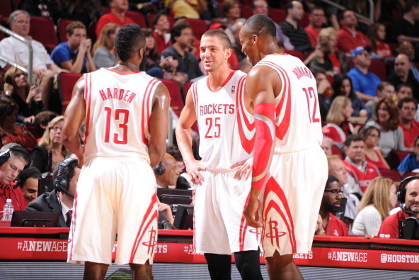 HOUSTON, TX - FEBRUARY 1:  Dwight Howard #12, Chandler Parsons #25 and James Harden #13 of the Houston Rockets talk during the game against the Cleveland Cavaliers on February 1, 2014 at the Toyota Center in Houston, Texas. NOTE TO USER: User expressly ac