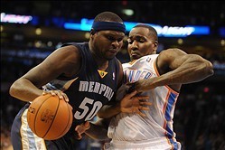 Feb 3, 2014; Oklahoma City, OK, USA;  Memphis Grizzlies power forward Zach Randolph (50) handles the ball against Oklahoma City Thunder center Kendrick Perkins (5) during the first quarter at Chesapeake Energy Arena. Mandatory Credit: Mark D. Smith-USA TO