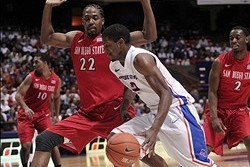Feb 5, 2014; Boise, ID, USA; Boise State Broncos guard Derrick Marks (2) dribbles the ball around San Diego State Aztecs forward Josh Davis (22) during the second half of play at Taco Bell Arena. The Aztecs won 67-65. Mandatory Credit: Brian Losness-USA T