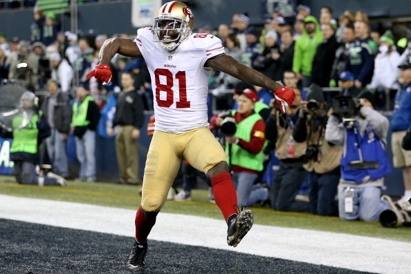 SEATTLE, WA - JANUARY 19:  Wide receiver Anquan Boldin #81 of the San Francisco 49ers celebrates after making a 26-yard touchdown catch against the Seattle Seahawks in the third quarter during the 2014 NFC Championship at CenturyLink Field on January 19, 