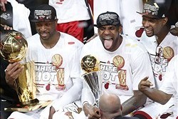 Jun 20, 2013; Miami, FL, USA; Miami Heat shooting guard Dwyane Wade (left), LeBron James (center) and Chris Bosh (right) celebrate after game seven in the 2013 NBA Finals at American Airlines Arena. Miami defeated the San Antonio Spurs 95-88 to win the NB
