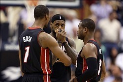 Dec 10, 2013; Indianapolis, IN, USA; Miami Heat forward LeBron James (6) talks to center Chris Bosh (1) and guard Dwayne Wade (3) during a game against the Indiana Pacers at Bankers Life Fieldhouse. Mandatory Credit: Brian Spurlock-USA TODAY Sports