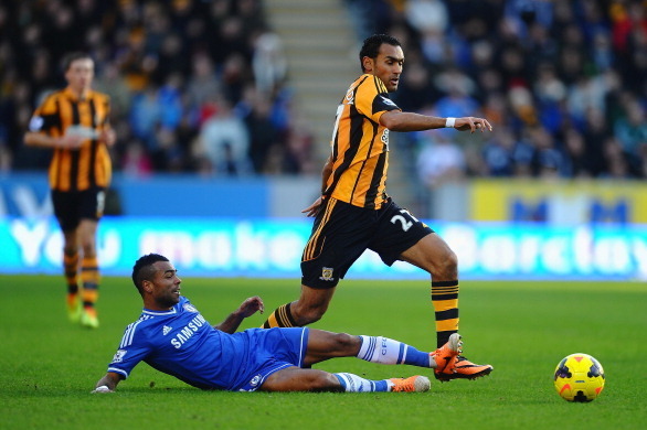 HULL, ENGLAND - JANUARY 11:  Ashley Cole of Chelsea tackles Ahmed Elmohamady of Hull City during the Barclays Premier League match between Hull City and Chelsea at KC Stadium on January 11, 2014 in Hull, England.  (Photo by Laurence Griffiths/Getty Images