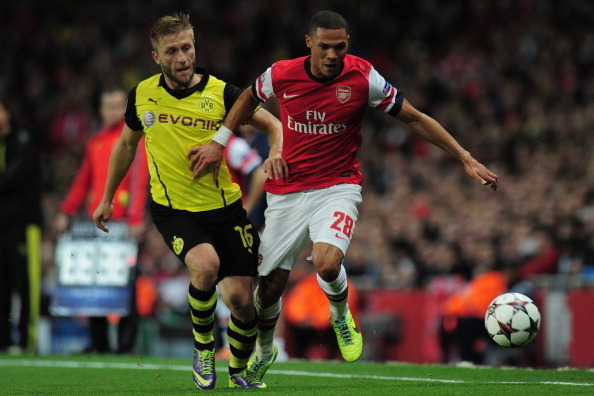 LONDON, ENGLAND - OCTOBER 22:  Jakub Blaszczykowski of Borussia Dortmund and Kieran Gibbs of Arsenal battle for the ball during the UEFA Champions League Group F match between Arsenal and  Borussia Dortmund at Emirates Stadium on October 22, 2013 in Londo