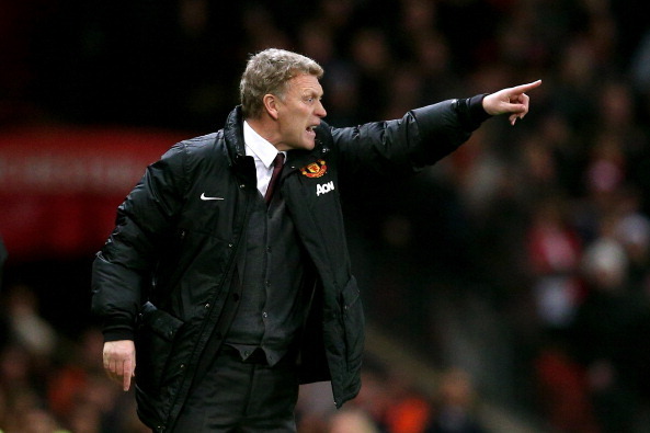 MANCHESTER, ENGLAND - JANUARY 22:  David Moyes the Manchester United manager directs his players during the Capital One Cup semi final, second leg match between Manchester United and Sunderland at Old Trafford on January 22, 2014 in Manchester, England.  