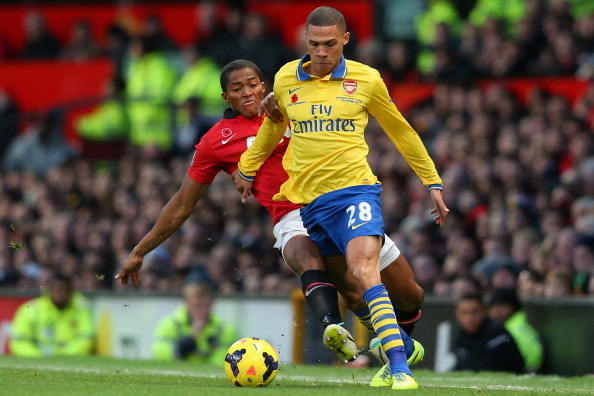 MANCHESTER, ENGLAND - NOVEMBER 10:  Kieran Gibbs of Arsenal is challenged by Antonio Valencia of Manchester United during the Barclays Premier League match between Manchester United and Arsenal at Old Trafford on November 10, 2013 in Manchester, England. 