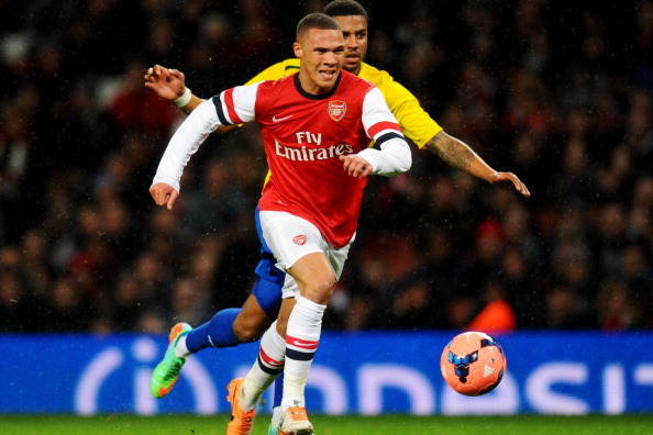 LONDON, ENGLAND - JANUARY 24:  Kieran Gibbs of Arsenal chases the ball with Cyrus Christie of Coventry City during the FA Cup with Budweiser Fourth round match between Arsenal and Coventry City at Emirates Stadium on January 24, 2014 in London, England.  