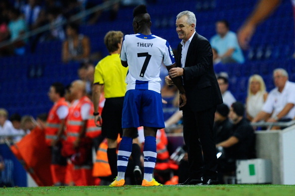 BARCELONA, SPAIN - AUGUST 24:  Head coach Javier Aguirre of RCD Espanyol gives instructions to Thievy Bifouma of RCD Espanyol during the La Liga match between RCD Espanyol and Valencia CF at Cornella-El Prat Stadium on August 24, 2013 in Barcelona, Spain.