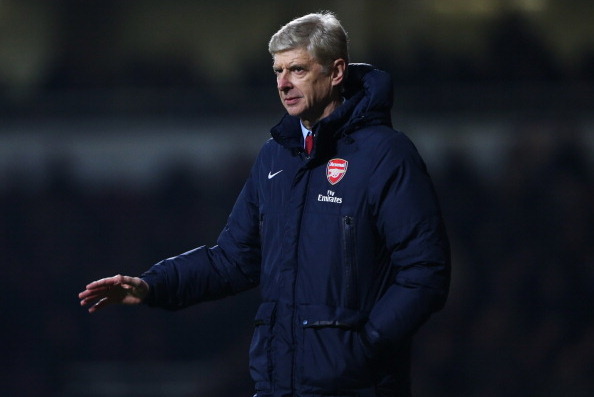 LONDON, ENGLAND - DECEMBER 26:  Arsene Wenger manager of Arsenal signals during the Barclays Premier League match between West Ham United and Arsenal at Boleyn Ground on December 26, 2013 in London, England.  (Photo by Ian Walton/Getty Images)
