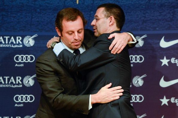 BARCELONA, SPAIN - JANUARY 23:  FCB Vice-President Josep Maria Bartomeu (R) hugs FCB President Sandro Rosell after the press conference announcing his resgination as FCB president on January 23, 2014 in Barcelona, Spain. FCB President Sandro Rosell is und