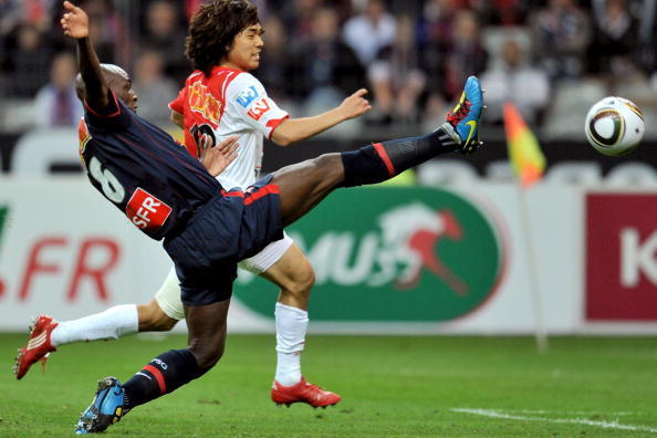 PARIS - MAY 01: Defender Zoumana Camara of the Paris Saint Germain football club (L) and Striker Chu Young Park of A.S Monaco (R) battle for the ball during the French Football Cup Final at Stade de France on May 1, 2010 in Paris, France. (Photo by Pascal