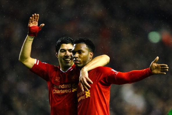 LIVERPOOL, ENGLAND - JANUARY 28:  Daniel Sturridge (R) of Liverpool is congratulated by teammate Luis Suarez (L) after scoring his team's third goal during the Barclays Premier League match between Liverpool and Everton at Anfield on January 28, 2014 in L