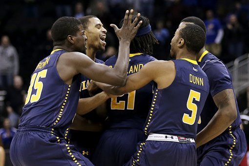 Tyrone Garland (being congratulated by teammates) and the rest of the Explorer team will be looking to recapture some of that Sweet 16 magic from last year's run against Saint Louis on Saturday.
