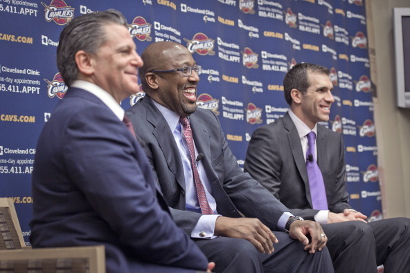 INDEPENDENCE, OH - APRIL 24:  Mike Brown of the Cleveland Cavaliers is introduced as the new head coach alongside majority owner Dan Gilbert and general manager Chris Grant at The Cleveland Clinic Courts on April 24, 2013 in Independence, Ohio in Clevelan