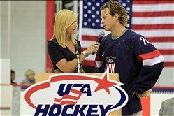 Aug 27, 2013; Arlington, VA, USA; Washington Capitals defenseman John Carlson (74) talks with NHL Network host Kathryn Tappen during a ceremony unveiling the 2014 Olympic hockey jersey as part of the 2013 U.S. men's national team camp at Kettler Capitals 