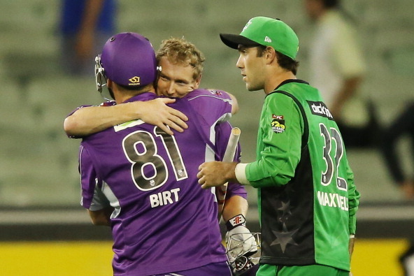 MELBOURNE, AUSTRALIA - FEBRUARY 04:  Travis Birt (L) and George Bailey of the Hurricanes celebrate their win next to Glenn Maxwell of the stars during the Big Bash League Semi Final match between the Melbourne Stars and the Hobart Hurricanes at Melbourne 