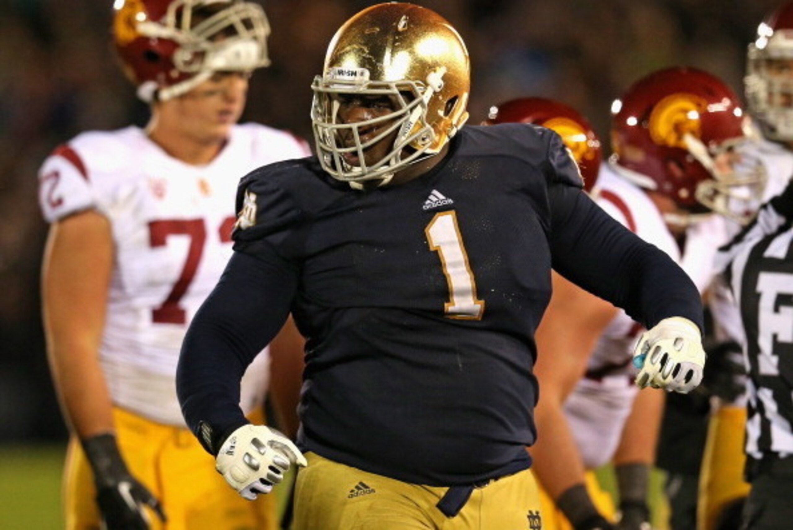 SOUTH BEND, IN - OCTOBER 19: Louis Nix III #1 of the Notre Dame Fighting Irish celebrates near the end of the game against the University of Southern California Trojans at Notre Dame Stadium on October 19, 2013 in South Bend, Indiana. Notre Dame defeated 