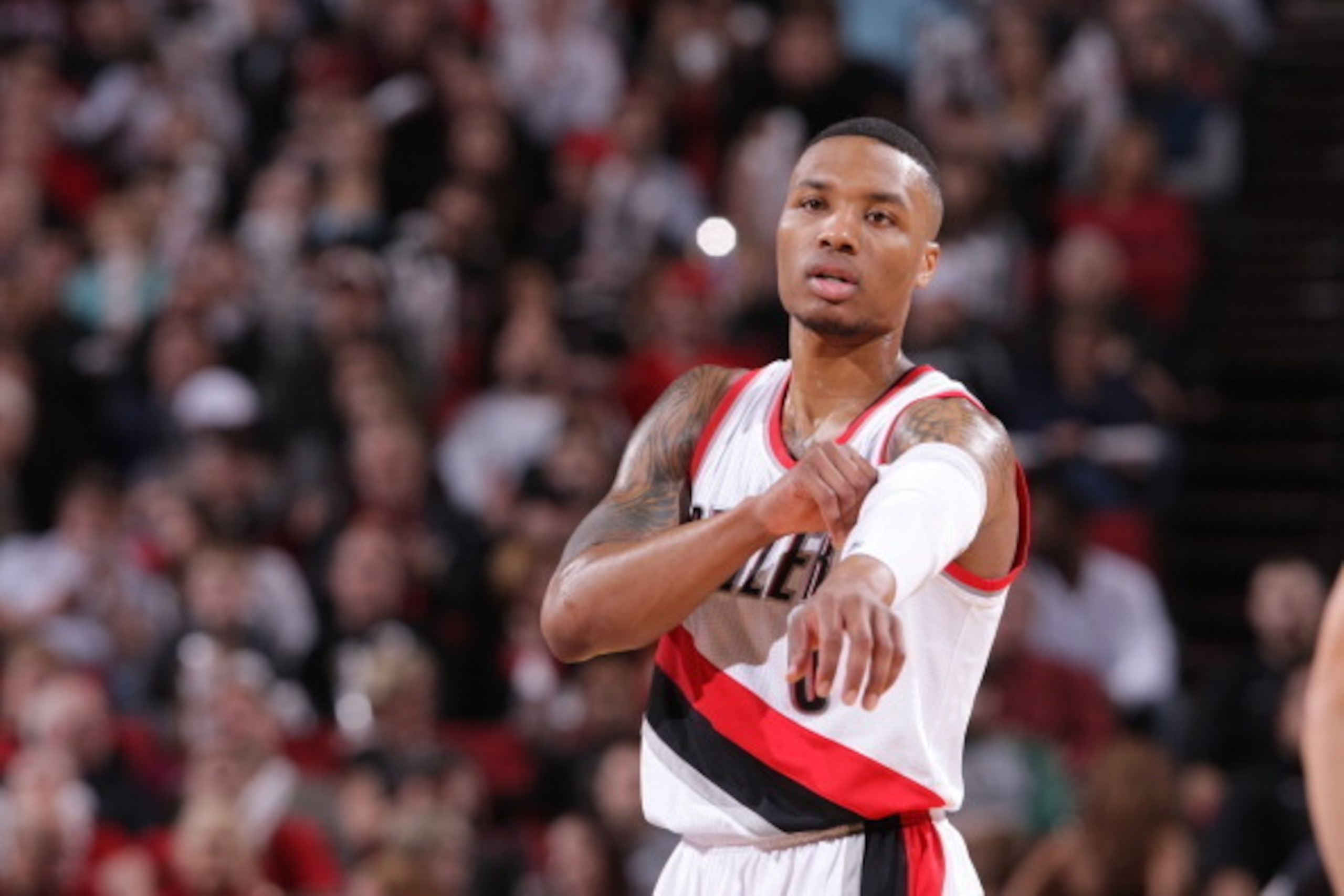PORTLAND, OR - JANUARY 28:  Damian Lillard #0 of the Portland Trail Blazers stands on the court against the Memphis Grizzlies on January 28, 2014 at the Moda Center Arena in Portland, Oregon. NOTE TO USER: User expressly acknowledges and agrees that, by d