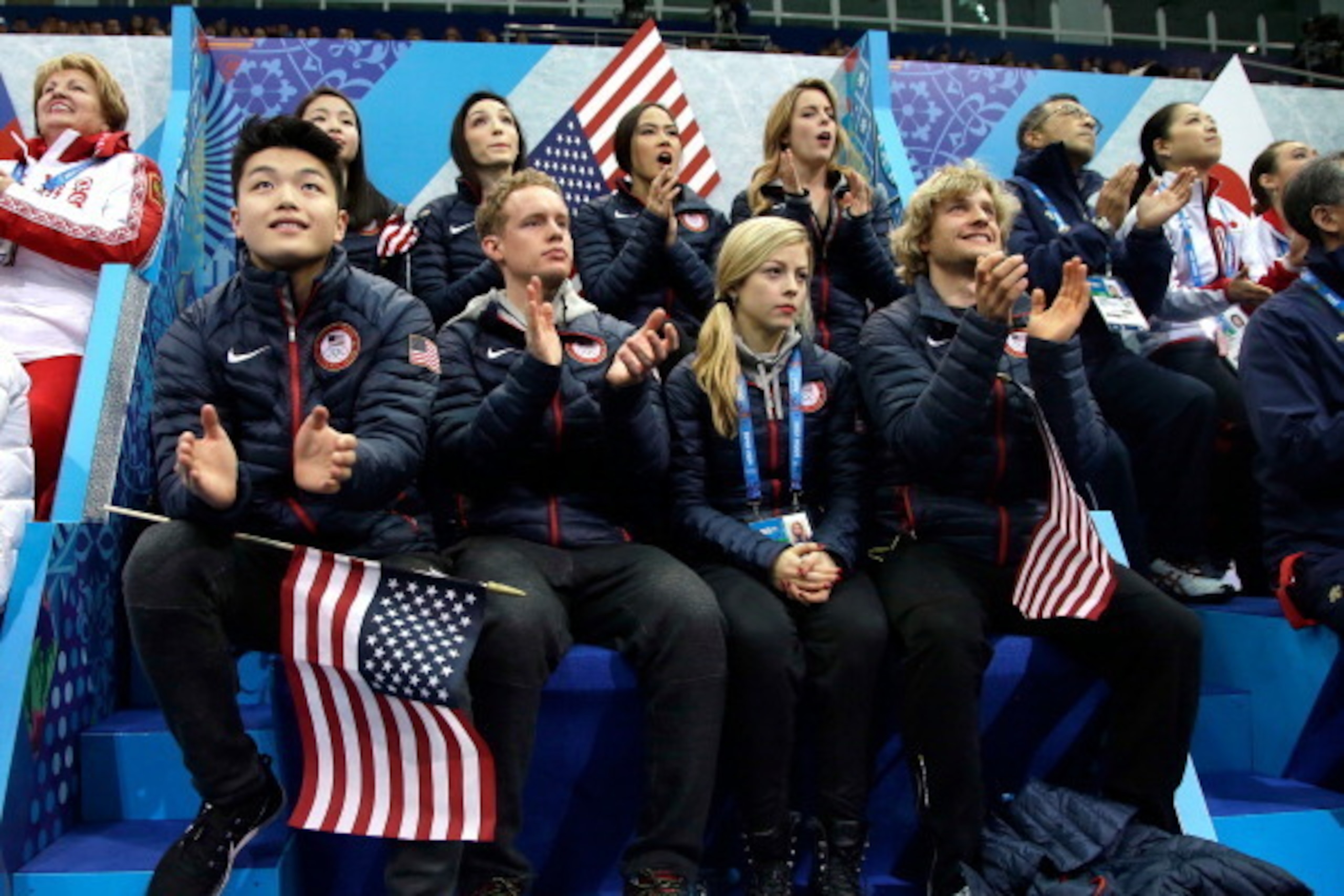 SOCHI, RUSSIA - FEBRUARY 06:  (Front L-R) Alex Shibutani, Evan Bates, Gracie Gold, Charlie White, (back L-R) Maia Shibutani, Meryl Davis, Madison Chock and Ashley Wagner of the United States look on as teammate Jeremy Abbott competes in the Figure Skating