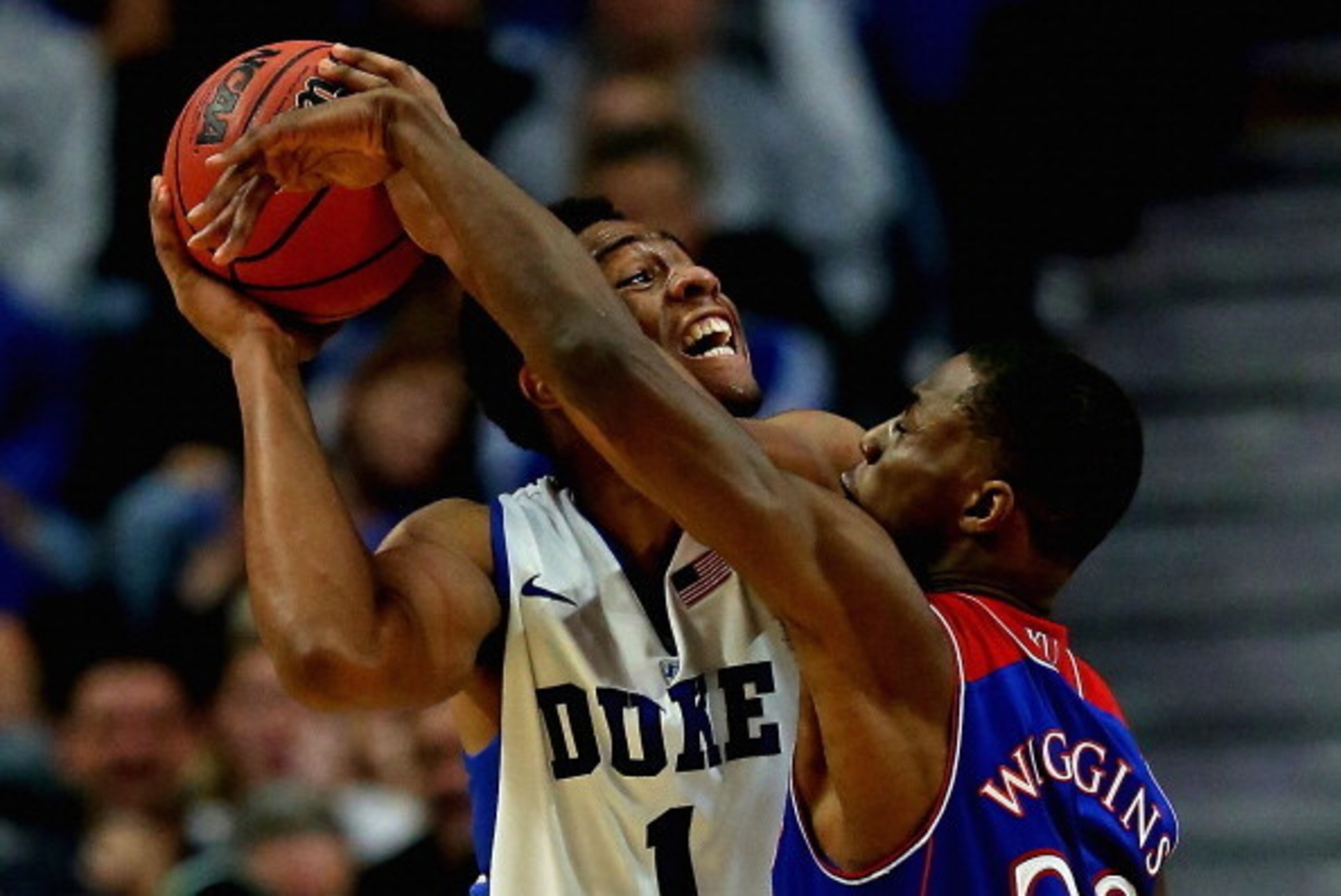 CHICAGO, IL - NOVEMBER 12: Jabari Parker #1 of the Duke Blue Devils tries to shoot against Andrew Wiggins #22 of the Kansas Jayhawks during the State Farm Champions Classic at the United Center on November 12, 2013 in Chicago, Illinois. Kansas defeated Du CHICAGO, IL - NOVEMBER 12: Jabari Parker #1 of the Duke Blue Devils tries to shoot against Andrew Wiggins #22 of the Kansas Jayhawks during the State Farm Champions Classic at the United Center on November 12, 2013 in Chicago, Illinois. Kansas defeated Du