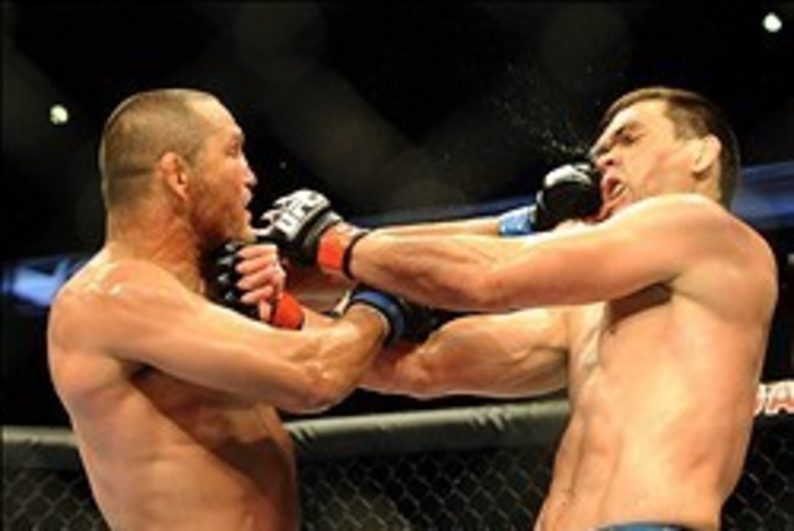 Feb 23, 2013; Anaheim, CA, USA; Dan Henderson (blue gloves) fights Lyoto Machida (red gloves) during their UFC welterweight bout at the Honda Center. Mandatory Credit: Jayne Kamin-Oncea-USA TODAY Sports