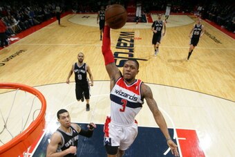 WASHINGTON, DC - FEBRUARY 5: Bradley Beal #3 of the Washington Wizards dunks against the San Antonio Spurs at the Verizon Center on February 5, 2014 in Washington, DC. NOTE TO USER: User expressly acknowledges and agrees that, by downloading and or using 