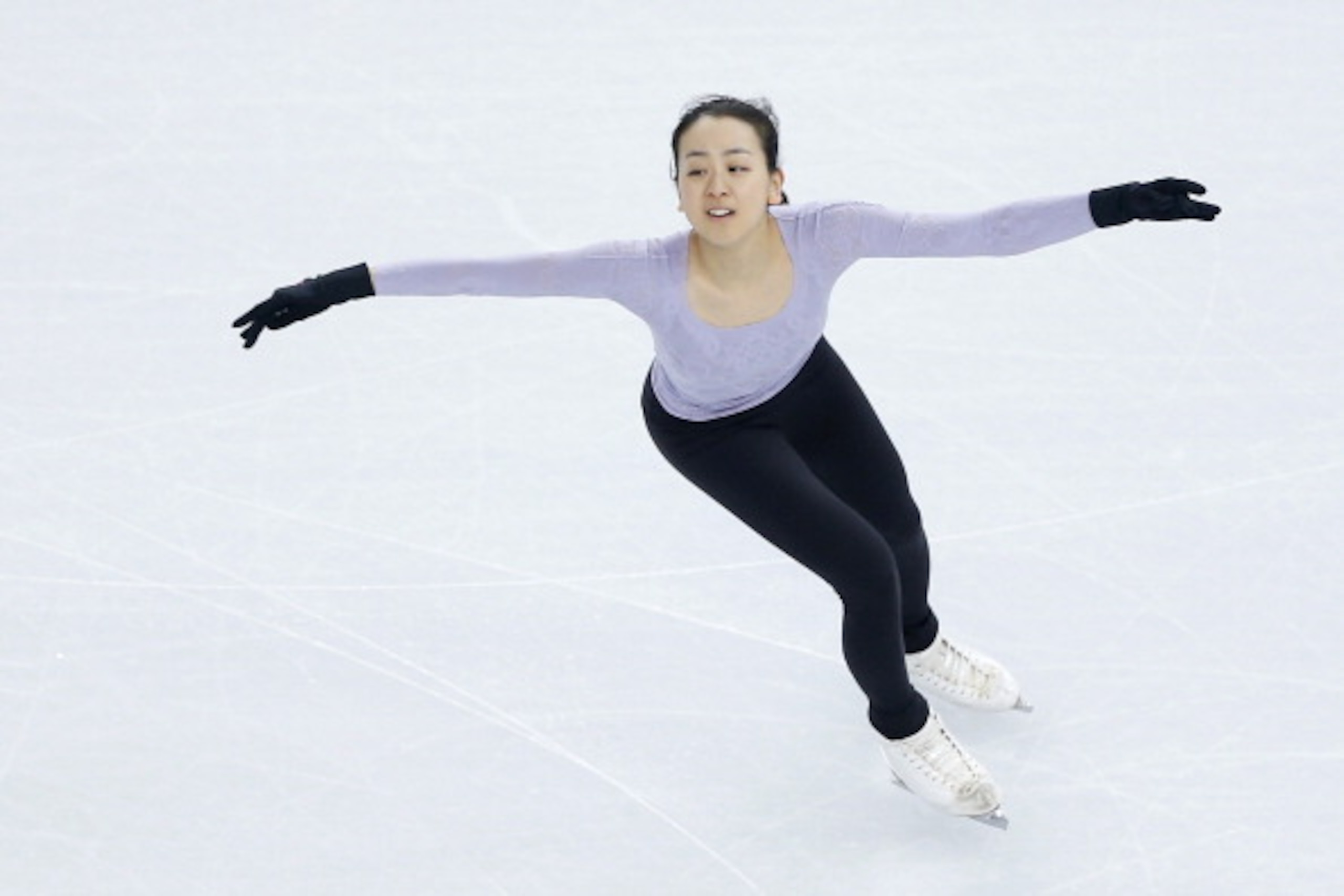 SOCHI, RUSSIA - FEBRUARY 06:  Figure skater Mao Asada of Japan practices at the Iceberg Skating Palace on February 6, 2014 in Sochi, Russia.  (Photo by Matthew Stockman/Getty Images)
