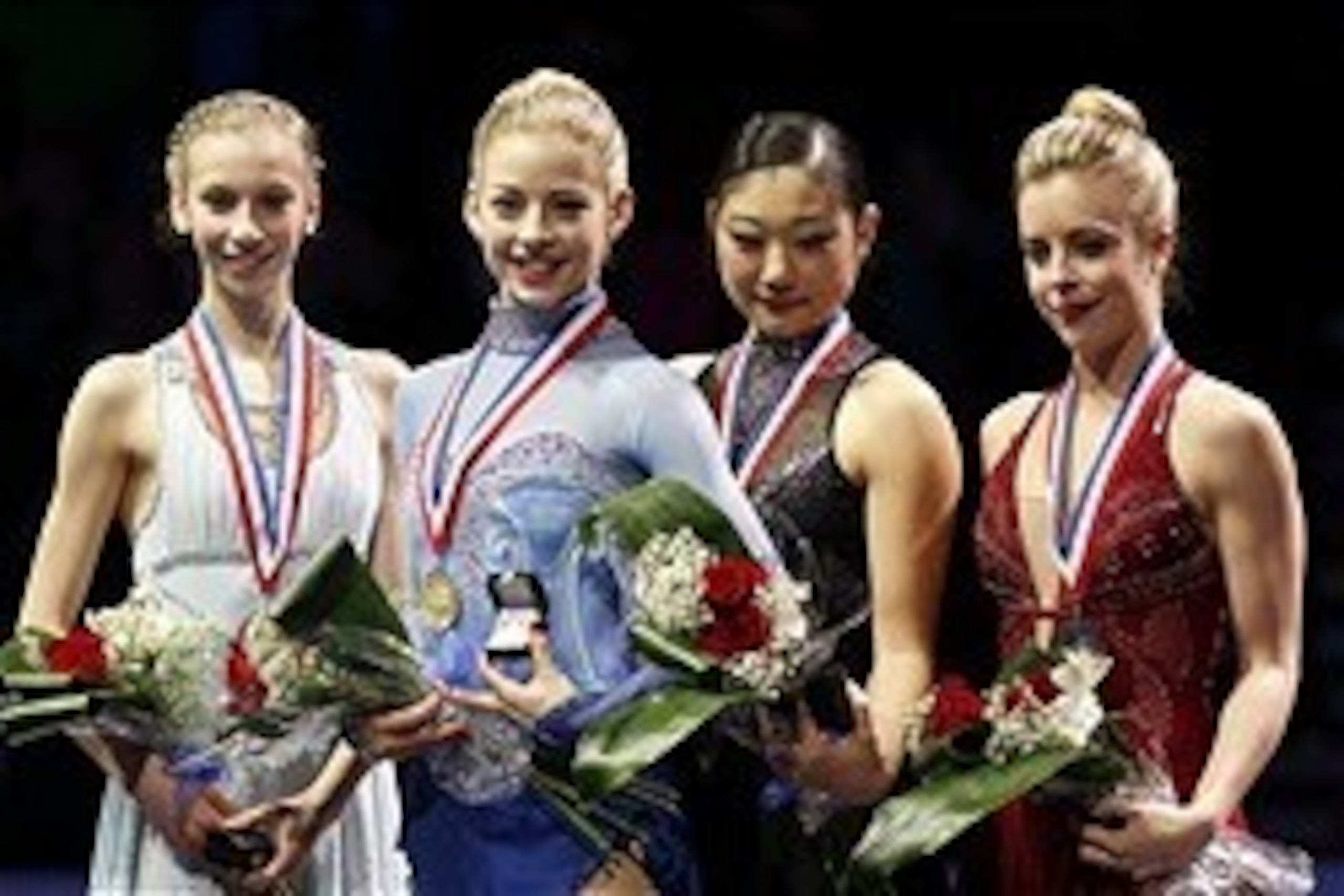 Jan 11, 2014; Boston, MA, USA;  (From left to right) Silver medalist Polina Edmunds , gold medalist Gracie Gold , bronze medalist Mirai Nagasu , pewter medalist Ashley Wagner stand on the podium after the Ladies Free Skate at the TD Garden. Mandatory Cred