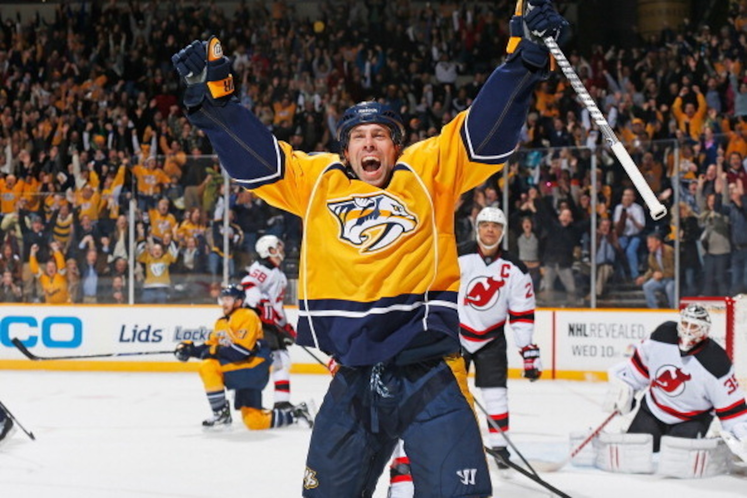 NASHVILLE, TN - JANUARY 31: David Legwand #11 of the Nashville Predators celebrates his game-tying goal in the final seconds against Cory Schneider #35 of the New Jersey Devils at Bridgestone Arena on January 31, 2014 in Nashville, Tennessee. (Photo by Jo