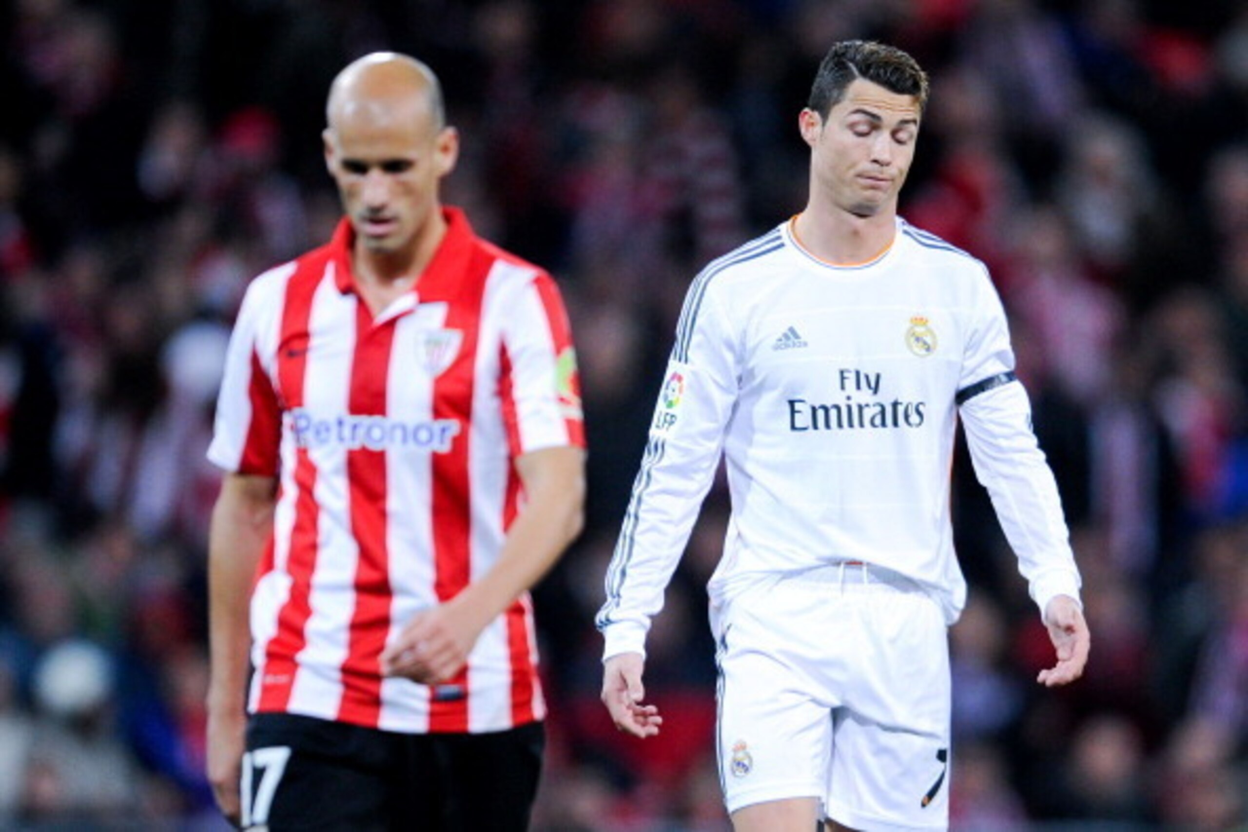 BILBAO, SPAIN - FEBRUARY 02:  Cristiano Ronaldo of Real Madrid CF reacts dejected next to Mikel Rico of Athletic Club during the La Liga match between Athletic Club and real Madrid CF at San Mames Stadium on February 2, 2014 in Bilbao, Spain.  (Photo by D