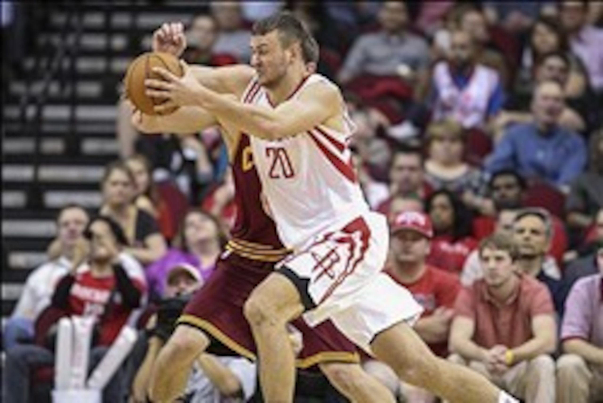 Feb 1, 2014; Houston, TX, USA; Houston Rockets power forward Donatas Motiejunas (20) drives the ball during the third quarter against the Cleveland Cavaliers at Toyota Center. The Rockets defeated the Cavaliers 106-92. Mandatory Credit: Troy Taormina-USA 