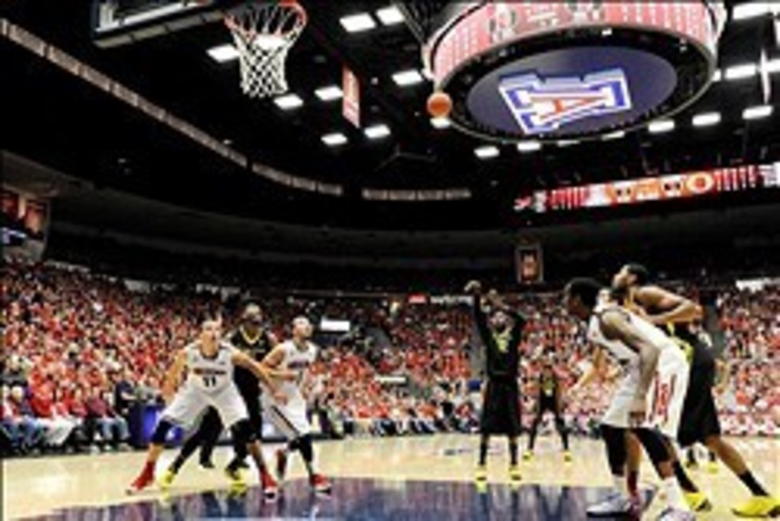 Feb 6, 2014; Tucson, AZ, USA; Oregon Ducks guard Jason Calliste (12) shoots a free throw during the first half against the Arizona Wildcats at McKale Center. Mandatory Credit: Casey Sapio-USA TODAY Sports