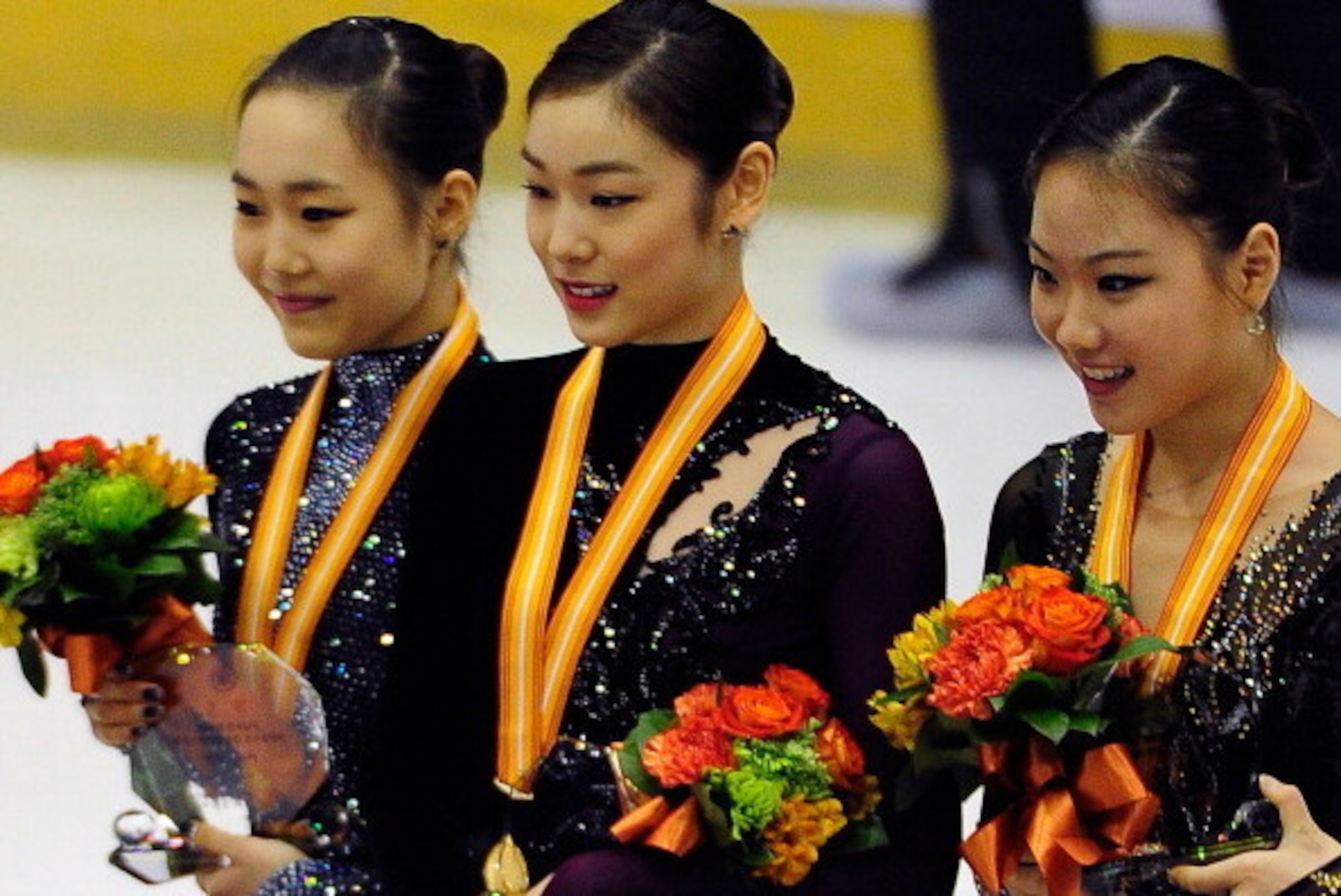 GOYANG, SOUTH KOREA - JANUARY 05:  (L-R) So-Yeon Park (2nd), Yuna Kim (1st) and Hae-Jin Kim (3rd) of South Korea celebrate during the Medal Ceremony for the Ladies Free Skating program during the Korea Figure Skating Championships 2014 at Goyang Oulimnuri