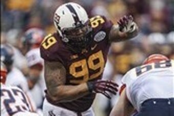 Dec 27, 2013; Houston, TX, USA; Minnesota Golden Gophers defensive lineman Ra'Shede Hageman (99) rushes the quarter back during the first quarter of the Texas Bowl against the Syracuse Orange at Reliant Stadium . Mandatory Credit: Troy Taormina-USA TODAY 