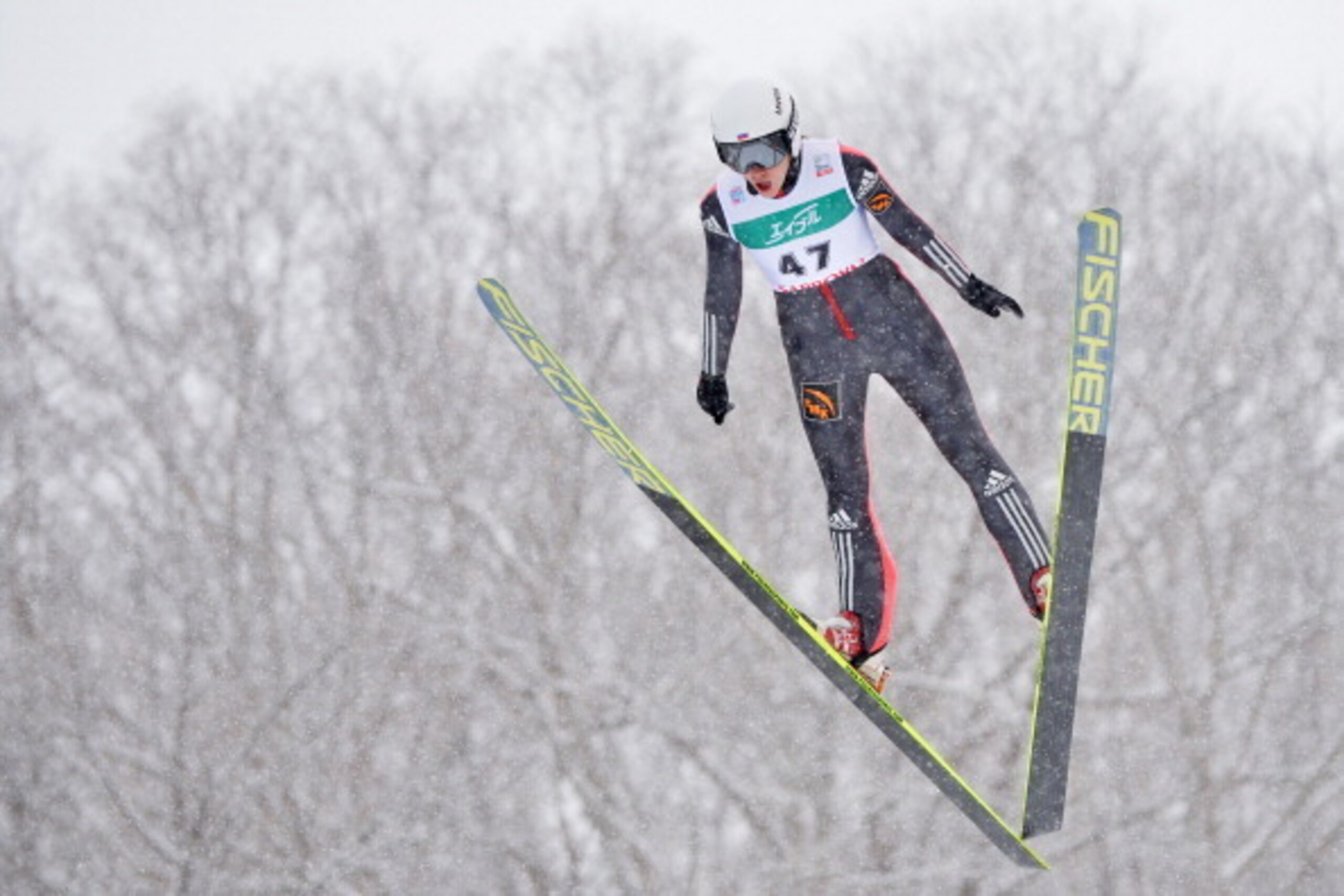 SAPPORO, JAPAN - JANUARY 12:  Irina Avvakumova of Russia competes in the normal hill individual 1st round during the FIS Women's Ski Jumping World Cup Sapporo at Miyanomori Ski Jump Stadium on January 12, 2014 in Sapporo, Japan.  (Photo by Atsushi Tomura/