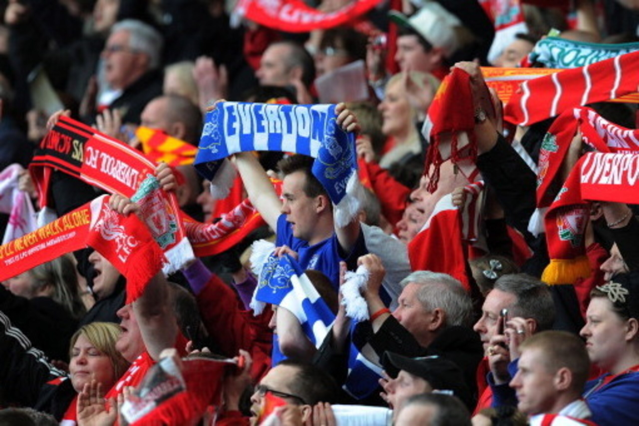LIVERPOOL, ENGLAND - APRIL 15:  (THE SUN OUT, THE SUN ON SUNDAY OUT) (NO SALES)  In this handout image provided by Liverpool FC, members of the congregation hold aloft Everton and Liverpool scarves during the 24th Hillsborough Anniversary Memorial Service