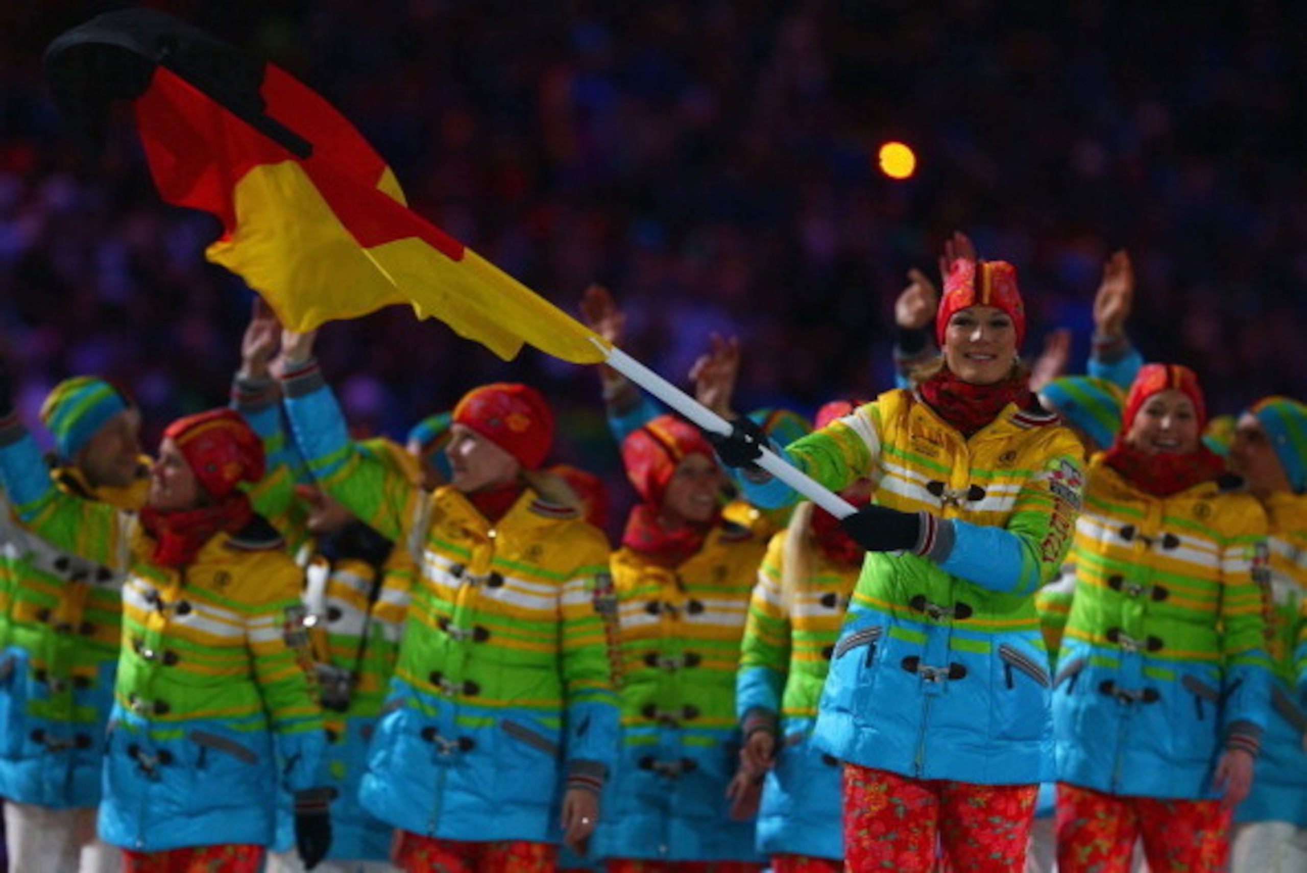 SOCHI, RUSSIA - FEBRUARY 07: Skier Maria Hoefl-Riesch of the Germany Olympic team carries her country's flag during the Opening Ceremony of the Sochi 2014 Winter Olympics at Fisht Olympic Stadium on February 7, 2014 in Sochi, Russia. (Photo by Paul Gilh SOCHI, RUSSIA - FEBRUARY 07: Skier Maria Hoefl-Riesch of the Germany Olympic team carries her country's flag during the Opening Ceremony of the Sochi 2014 Winter Olympics at Fisht Olympic Stadium on February 7, 2014 in Sochi, Russia. (Photo by Paul Gilh