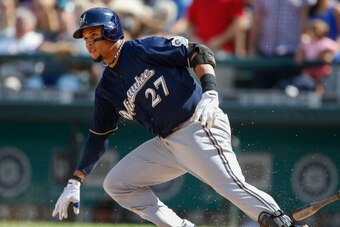 SEATTLE, WA - AUGUST 11:  Carlos Gomez #27 of the Milwaukee Brewers grounds out for the final out against the Seattle Mariners at Safeco Field on August 11, 2013 in Seattle, Washington. The Mariners defeated the Brewers 2-0.  (Photo by Otto Greule Jr/Gett